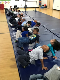 Gymnasts performing back bends